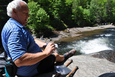 Lee enjoying lunch on the edge