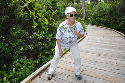 Karen gets attacked by a vine stretching over the boardwalk