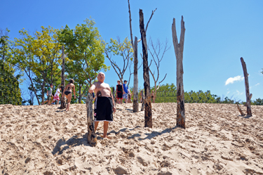 Lee Duquette almost to the top of the sand dune