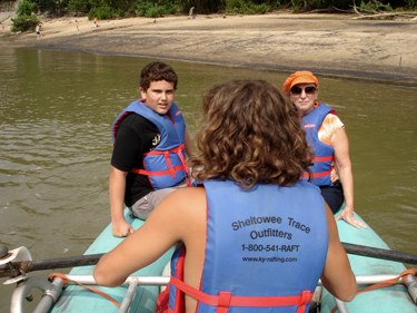 Karen Duquette and her grandson in the raft