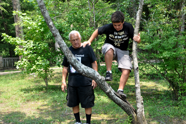 Alex climbing a tree