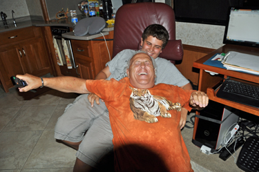 Lee and Alex wrestle for the recliner