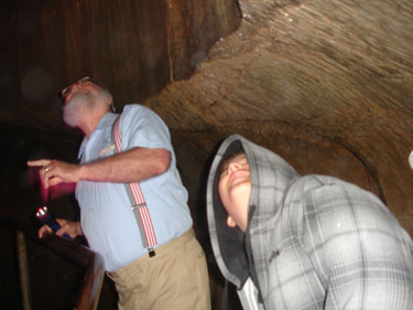 the grandson of the two RV Gypsies Walking behind the waterfall  at Ruby Falls