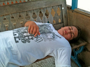 Alex takes a short nap on the tram ride to the car
