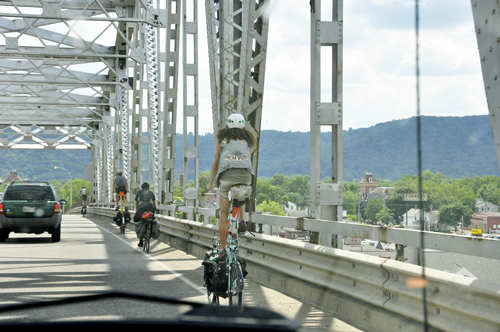 people riding high-rise bicycles.