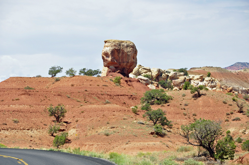 a single rock on a hill