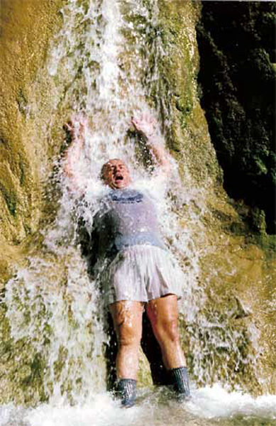 Lee Duquette under the cold waterfall