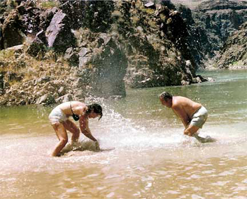 Lee and one of the other rafters play in the cold waters of the Grand Canyon