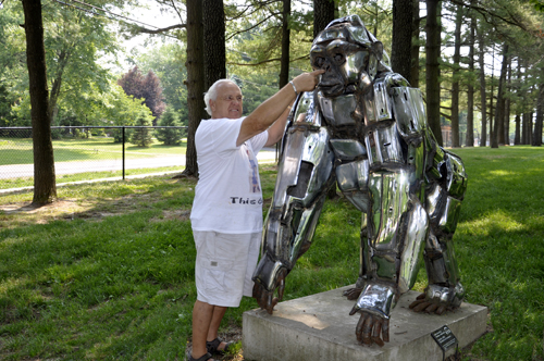 Lee Duquette poking Mount Vernon's chrome gorilla in the nose