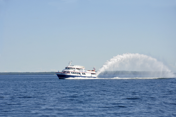 a jet boat with a big rooster tail