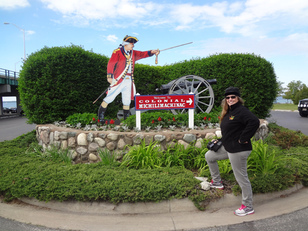 Karen Duquette at the entry to Colonial Michilimackinac