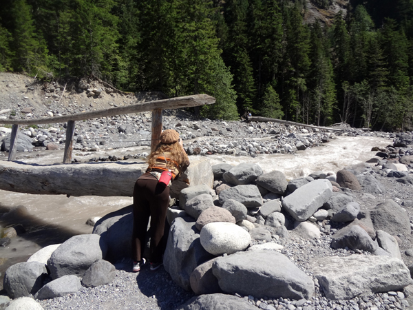 Karen Duquette taking photos of the river