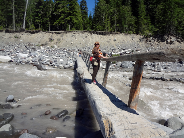 Karen Duquette on the log bridge