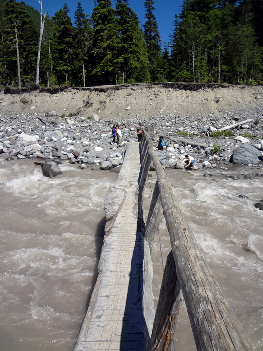 Karen Duquette coming back over the log bridge