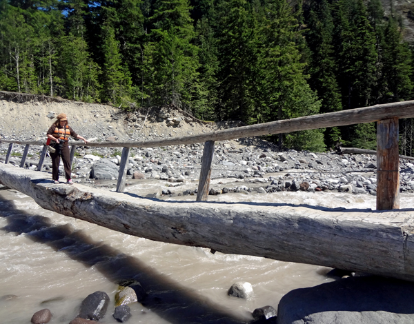 Karen Duquette coming back over the log bridge