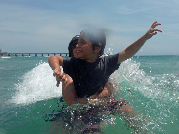 Karen Duquette and her great-grandson in the ocean