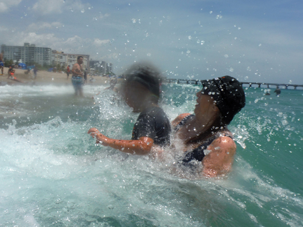 Karen Duquette and her great-grandson in the ocean
