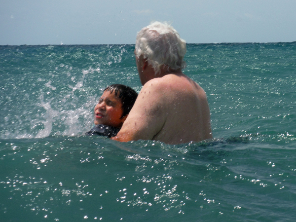 Lee Duquette and his great-grandson in the ocea