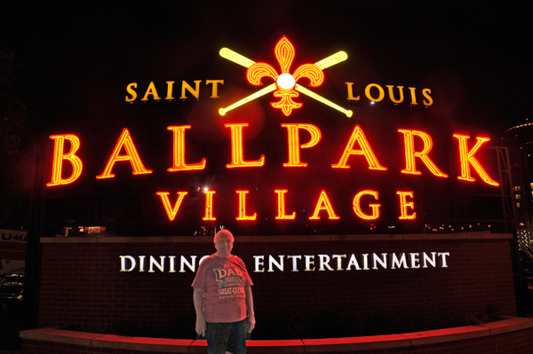 Lee Duquette bu the Ballpark Village sign