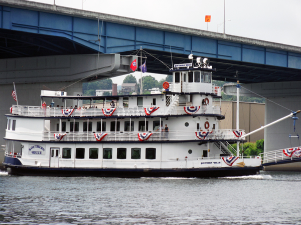 a boat passing under the bridge