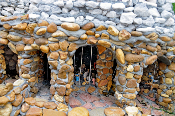 close-up of a miniature building and people
