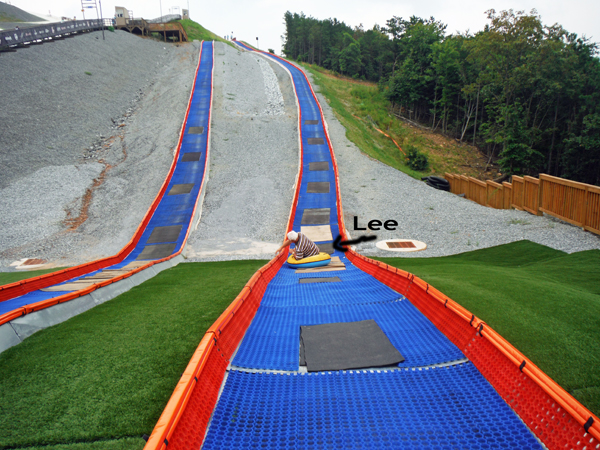 Lee Duquette tubing down the hill at Snowflex