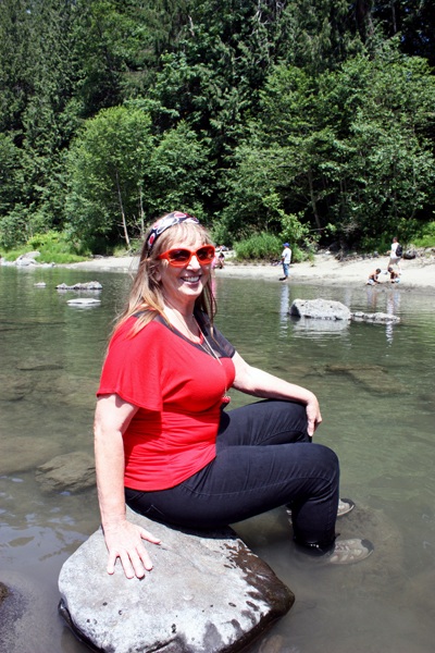 Karen relaxing with her feet in the water