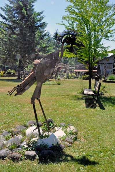 giant bird sculpture with hatched eggs