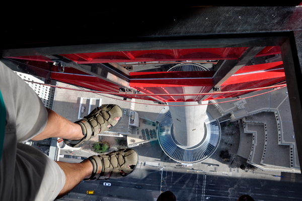 the feet of Lee Duquette on the glass floor