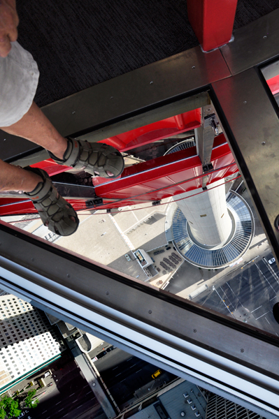 the feet of Lee Duquette on the glass floor
