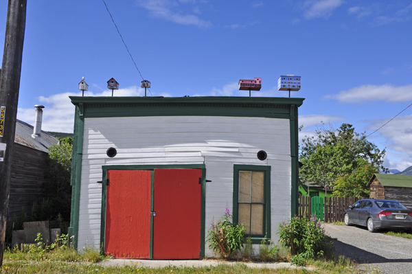 bird houses on a building roof