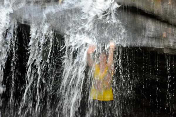 Karen Duquette behind the waterfall