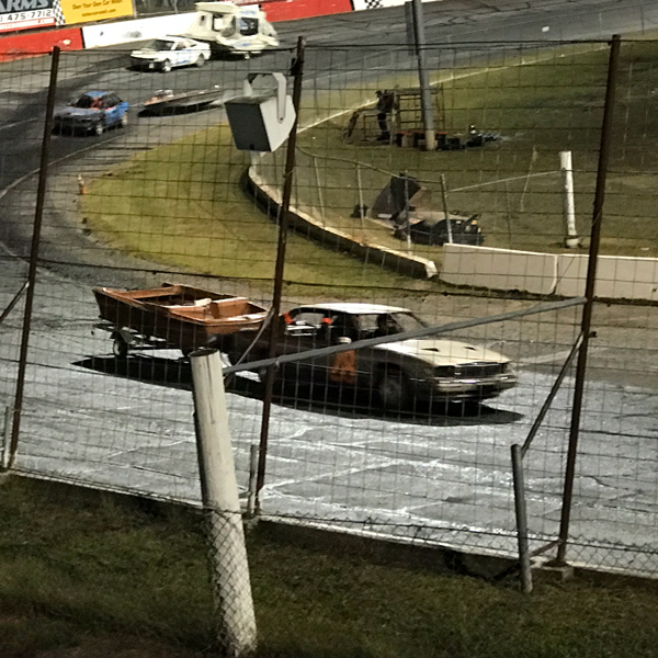 car towing a boat
