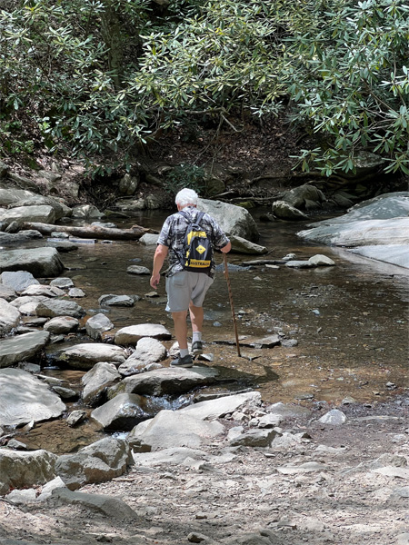 Lee Duquette crossing the creek