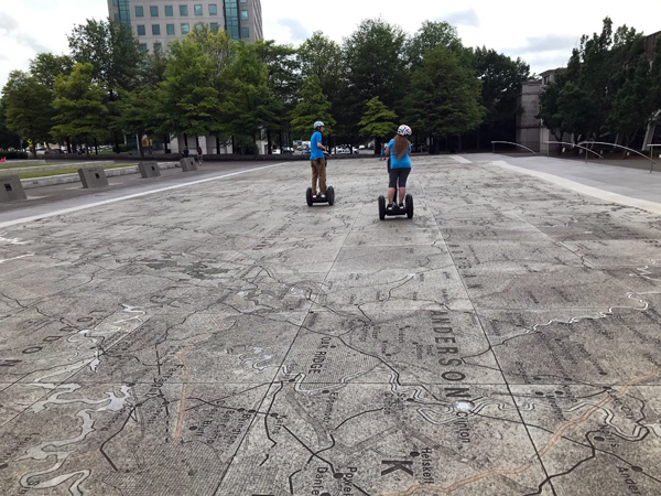 Karen Duquette on a giant road map