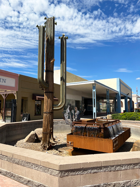 metal cacti and fountain