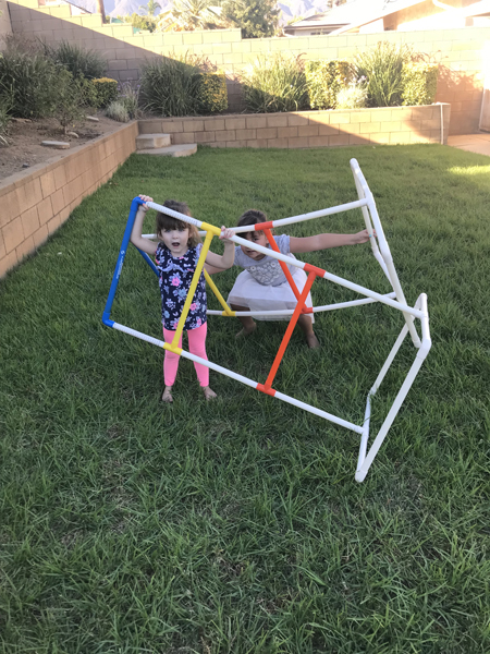 JJ and Emily playing in the yard