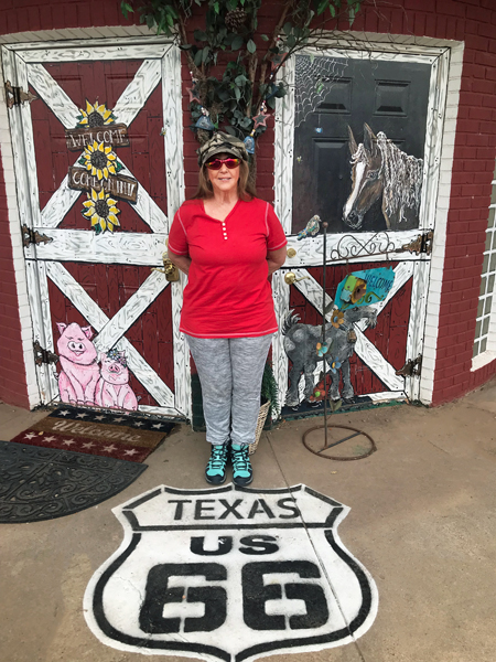 Karen Duquette on Route 66 sign