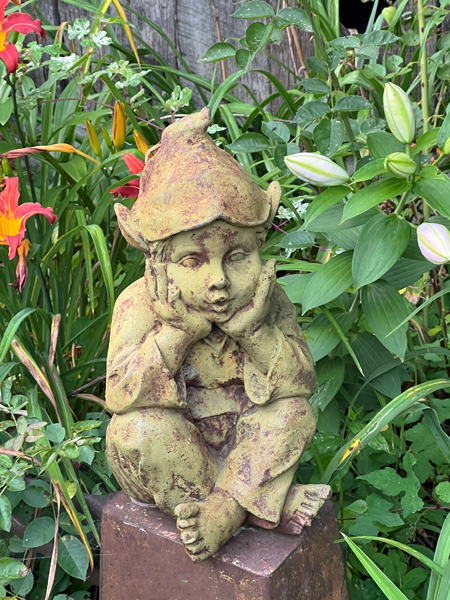 statue at Log House 1776 Restaurant Garden
