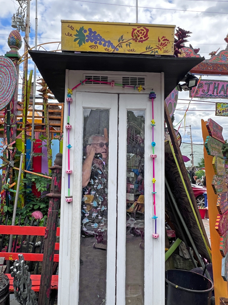 Lee Duquette in a phone booth