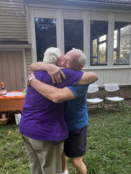 Lee and his brother hug each other