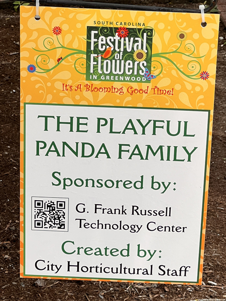 The Playful Panda Family sign