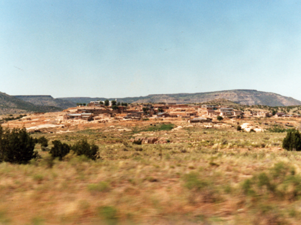 Rocks on the mountains and houses at the base of the mountains. 