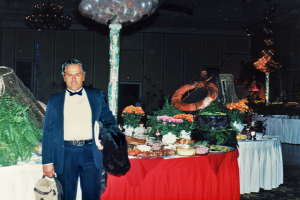 Lee Duquette near the buffet table