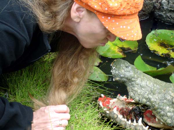 Karen  Duquette kissing an alligator in Australia