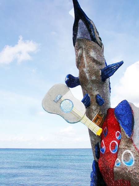 beautiful dolphin statue by the sea