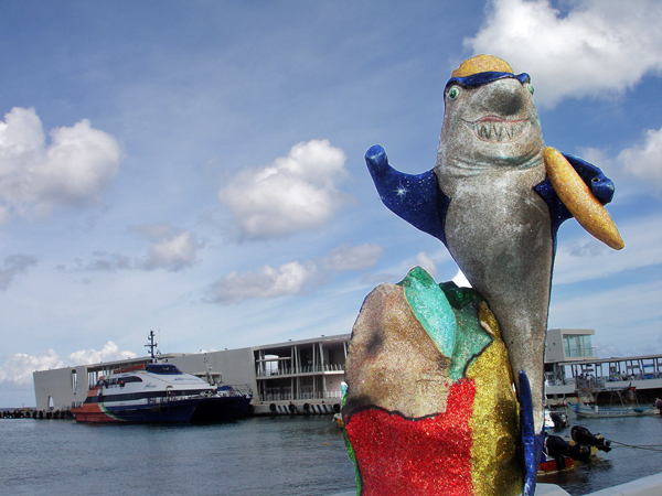 beautiful dolphin  and fish statue by the sea