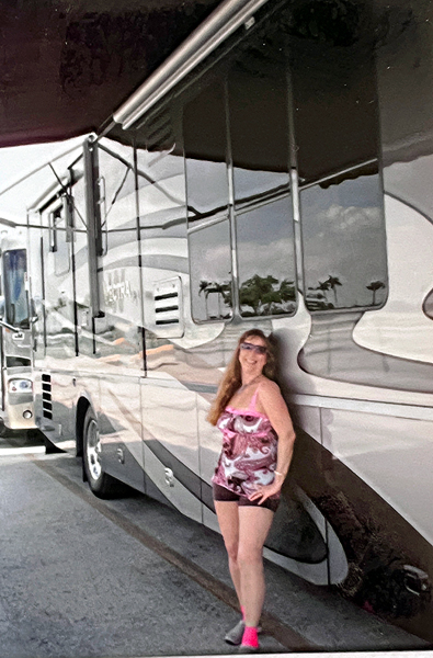 Karen Duquette outside of the RV
