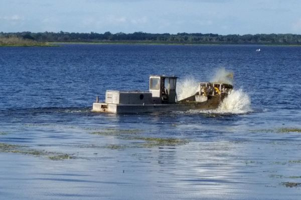 a weed-cleaner boat on Orange Lake.