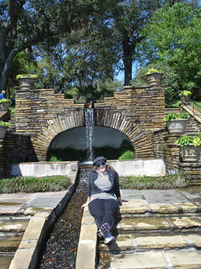 Karen sitting by a fountain